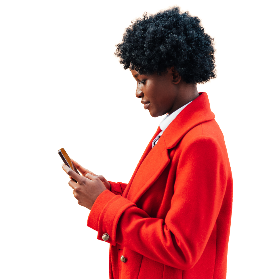 A woman in a red coat with a phone